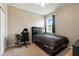 This bedroom offers a cozy retreat, with a bed, desk, and comfortable chair for study or relaxation at 2718 Limerick Cir, Grand Island, FL 32735
