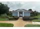 Charming clubhouse with well-kept landscaping and a welcoming entrance at 2718 Limerick Cir, Grand Island, FL 32735