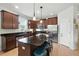 Kitchen with granite countertops, stainless steel appliances and a kitchen island with seating at 2718 Limerick Cir, Grand Island, FL 32735