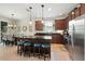 Spacious kitchen with an island, granite countertops, stainless steel appliances, and ample cabinet space at 2718 Limerick Cir, Grand Island, FL 32735