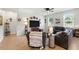 Comfortable living room features stylish decor, large tv, and ample natural light from the windows at 2718 Limerick Cir, Grand Island, FL 32735