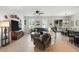 Open-concept living room, featuring a comfortable seating area and adjacent dining space at 2718 Limerick Cir, Grand Island, FL 32735