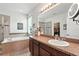 Main bathroom features double sinks, a soaking tub, a separate shower, and a walk-in closet at 2718 Limerick Cir, Grand Island, FL 32735