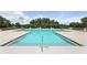 Inviting community pool surrounded by ample lounge chairs for relaxation at 2718 Limerick Cir, Grand Island, FL 32735