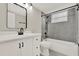 Modern bathroom with tiled shower, white vanity, and black fixtures at 2739 N Poinciana Blvd # 77, Kissimmee, FL 34746