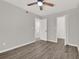 This bedroom features hardwood floors and multiple doorways to other rooms at 2739 N Poinciana Blvd # 77, Kissimmee, FL 34746