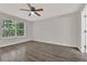 Spacious bedroom featuring hardwood floors, a large window, and neutral paint at 2739 N Poinciana Blvd # 77, Kissimmee, FL 34746