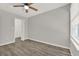 Neutral bedroom featuring hardwood floors, a window, and a closet at 2739 N Poinciana Blvd # 77, Kissimmee, FL 34746