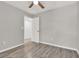 This bedroom features hardwood floors and a doorway to another room at 2739 N Poinciana Blvd # 77, Kissimmee, FL 34746