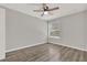 Neutral bedroom featuring a ceiling fan, hardwood floors, and a window at 2739 N Poinciana Blvd # 77, Kissimmee, FL 34746