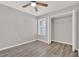 This bedroom features hardwood floors and a closet for ample storage at 2739 N Poinciana Blvd # 77, Kissimmee, FL 34746