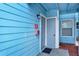 Exterior of unit with modern door and alarm box on the wall at 2739 N Poinciana Blvd # 77, Kissimmee, FL 34746