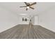 Open-concept living and dining area with sleek flooring, seamlessly connecting living spaces at 2739 N Poinciana Blvd # 77, Kissimmee, FL 34746