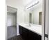 Bathroom featuring a vanity with storage and laminate wood flooring at 281 Covent Gardens Pl, Deltona, FL 32725