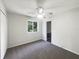 Bedroom showcasing neutral paint, updated carpet, window, and an ensuite bathroom at 281 Covent Gardens Pl, Deltona, FL 32725