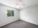 Bedroom features neutral paint, updated carpet, a ceiling fan, and a closet at 281 Covent Gardens Pl, Deltona, FL 32725