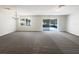 Spacious living room featuring neutral walls, carpet, recessed lighting, and a glass sliding door at 281 Covent Gardens Pl, Deltona, FL 32725