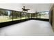 Large screened patio with ceiling fans overlooking green grass and a shed at 281 Covent Gardens Pl, Deltona, FL 32725