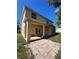 View of the home's backyard and patio with French doors at 402 Big Sioux Ct, Kissimmee, FL 34759