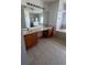 Bathroom with double sink vanity and tiled floors, plus soaking tub and walk-in shower at 402 Big Sioux Ct, Kissimmee, FL 34759