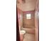 Bathroom showcasing a tiled shower/tub and a bright window at 402 Big Sioux Ct, Kissimmee, FL 34759
