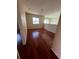 Sunlit bedroom boasting hardwood floors and ample natural light at 402 Big Sioux Ct, Kissimmee, FL 34759