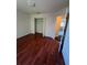 Bright bedroom features beautiful hardwood floors and a spacious closet at 402 Big Sioux Ct, Kissimmee, FL 34759