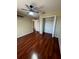 Bedroom featuring hardwood floors, closet, and a ceiling fan at 402 Big Sioux Ct, Kissimmee, FL 34759