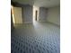 Bedroom with an open doorway and durable floor covering, perfect for relaxation at 402 Big Sioux Ct, Kissimmee, FL 34759