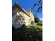Exterior side view of the two-story home at 402 Big Sioux Ct, Kissimmee, FL 34759