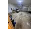 Spacious garage with ample storage and a roll-up door for easy access at 402 Big Sioux Ct, Kissimmee, FL 34759