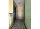 Upstairs hallway with a view to the rooms and durable floor covering connecting the main areas of the house at 402 Big Sioux Ct, Kissimmee, FL 34759