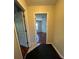 Entryway leading to bedroom with hard wood floors at 402 Big Sioux Ct, Kissimmee, FL 34759