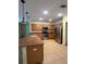 Modern kitchen featuring stainless steel appliances, ample counter space, and tile flooring at 402 Big Sioux Ct, Kissimmee, FL 34759