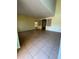 Spacious living room featuring tile flooring and architectural columns, ready for your personal touch at 402 Big Sioux Ct, Kissimmee, FL 34759