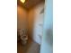 A small toilet room with shelves at 402 Big Sioux Ct, Kissimmee, FL 34759