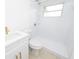 Updated bathroom featuring new vanity, sink, and walk-in shower with white tile and brushed gold accents at 4469 Evers Pl, Orlando, FL 32811