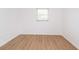 This bedroom is bright with a laminate floor and a window at 4469 Evers Pl, Orlando, FL 32811