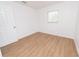 This bedroom is bright with a laminate floor and a window at 4469 Evers Pl, Orlando, FL 32811