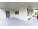 Inviting front porch with secure entrance and storm door, offering a warm welcome at 4469 Evers Pl, Orlando, FL 32811