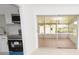 Updated kitchen featuring stainless steel appliances and a sliding door entrance to a sunroom at 4469 Evers Pl, Orlando, FL 32811