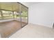 Bright sun room with hardwood floors and large windows overlooking the backyard at 4469 Evers Pl, Orlando, FL 32811