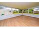 Enclosed sunroom provides extra space and light with backyard view at 4469 Evers Pl, Orlando, FL 32811