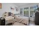 Bright bedroom with decor, desk, and natural light from dual windows at 461 Diamond Dove Cv, Winter Springs, FL 32708