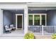 Charming front porch featuring comfortable seating and stylish decor at 461 Diamond Dove Cv, Winter Springs, FL 32708