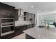 Modern kitchen featuring stainless steel appliances, granite countertops, and ample cabinet space at 461 Diamond Dove Cv, Winter Springs, FL 32708