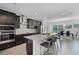 Beautiful kitchen featuring modern appliances, granite countertops, and a spacious island with bar seating at 461 Diamond Dove Cv, Winter Springs, FL 32708