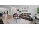 Open-concept living room features modern decor and ample natural light at 461 Diamond Dove Cv, Winter Springs, FL 32708