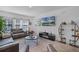 Comfortable living room with a large flat-screen TV, modern decor, and ample seating at 461 Diamond Dove Cv, Winter Springs, FL 32708