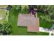 Overhead view of house with brown roof surrounded by large yard and shrubbery at 4757 Goldsboro Ct, Orlando, FL 32811